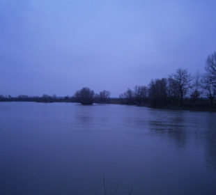 The river swollen by the rains and snow melting