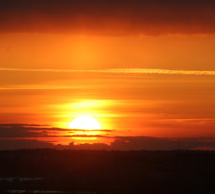 Wschód słońca na promie