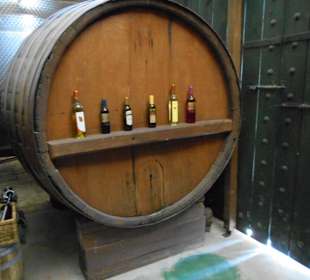 Barell with bottles on display