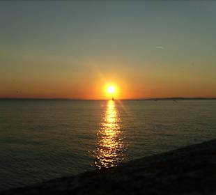 Segelschiff beim Sonnenuntergang in Langenargen
