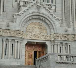 The facade crowned by a frieze and the doors are m