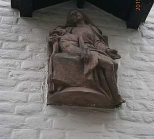 Small effigy on the wall