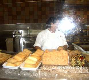 Indianerin bei der Speisenzubereitung