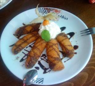 Nachspeise gebackene Banane mit Kokos