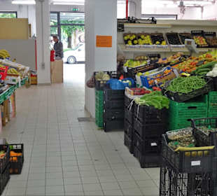 Gemüsehändler in der Markthalle