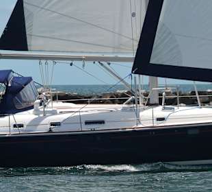 Full sail by Miami Beach returning to marina 