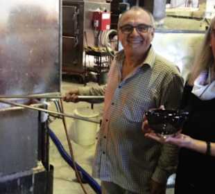 A satisfied customer picking up their unique piece