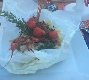 Seehecht mit Languste im Pergament