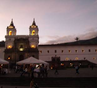 Volcano and sunset in old town Quito