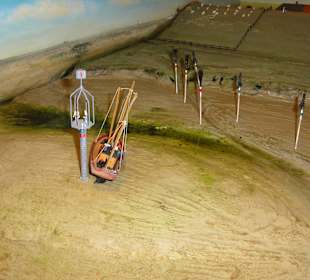 Küstendiorama mit auflaufendem Wasser