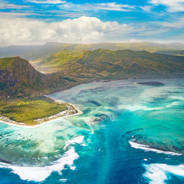 Aerial view of the underwater waterfall and Le Morne Brabant peninsula. Amazing Mauritius landscape